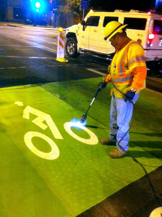 New green pavement and bike legends are added to Fifth Avenue and Broadway Boulevard. 