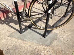 The city replaced the asphalt with concrete to make the rack more secure. 