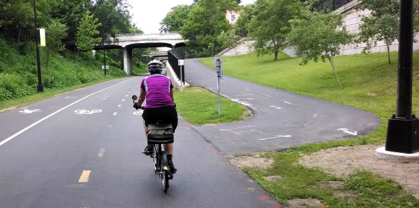 The Midtown Greenway bisects Minneapolis east to west. It is for bikes only with a separated section for pedestrians.  Part of the Greenway even is a divided bikeway, one large separated lane in each direction just for bikes separated by a patch of grass in the middle.