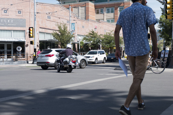 A UAPD officer stops a motorist after a bike box infraction. 