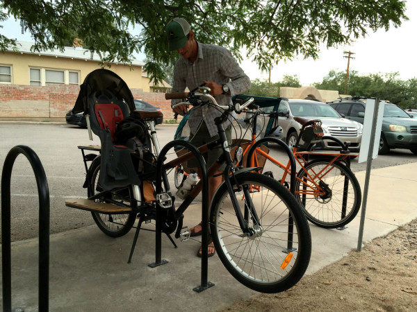 The racks were already being used by biking families. The racks were installed at the end of the concrete area in front of the parking. 