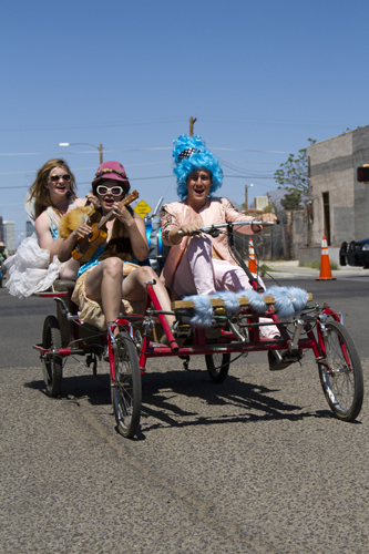 Members of the Parasol Project bike through the streets of Tucson in the Bike Beautiful procession during Cyclovia, a car-free day of bike riding, in Tucson Ariz on 28 March 2011.  The Parasol project organized the Bike Beautiful procession to celebrate the beauty of bike culture.