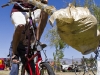 A man readies for a joust on a tall bike for the Bike Beautiful procession during Cyclovia, a car-free day of bike riding, in Tucson Ariz, on 28 March 2011.  He ended up winning the jousting match.