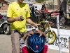 Zacharia Gladney, bottom, is told whats wrong with his bike by Steve Vihel, owner of There and Back Bikes, during Cyclovia in Tucson Ariz, on 28 March 2011.  Gladney\'s chain was loose, he said it had fallen off 20 times before stopping here.