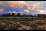 Monsoon rainbow and sunset, Rillito River Bike Path. Photo by Sandy Mallon, copyright 2014.